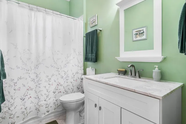 a view of chair and table in back yard of the house