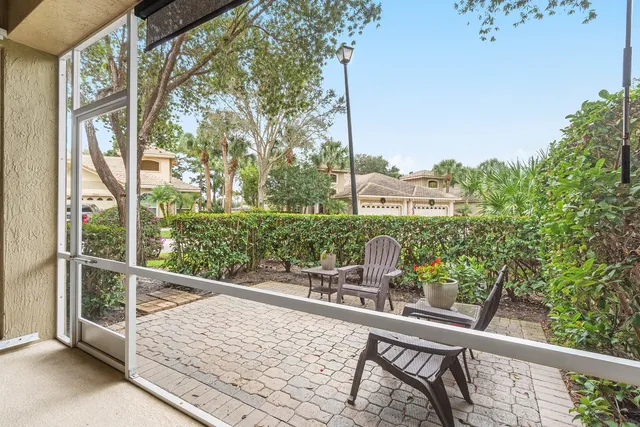 a living room with furniture pool table and a rug