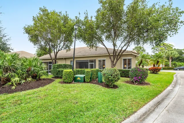 an aerial view of a residential houses with outdoor space