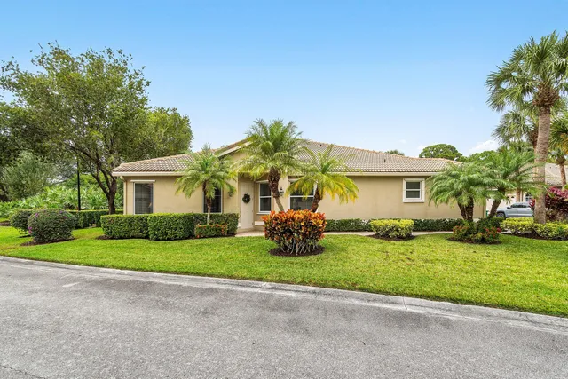 a living room with furniture rug and a table