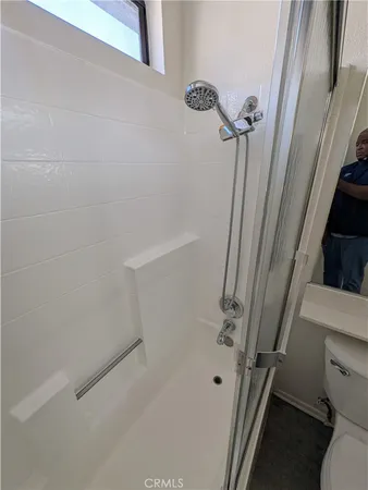 a bathroom with a sink toilet and mirror