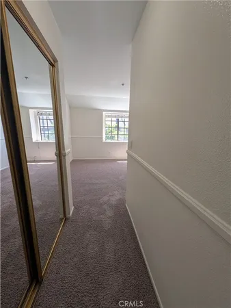 a view of a hallway view with staircase