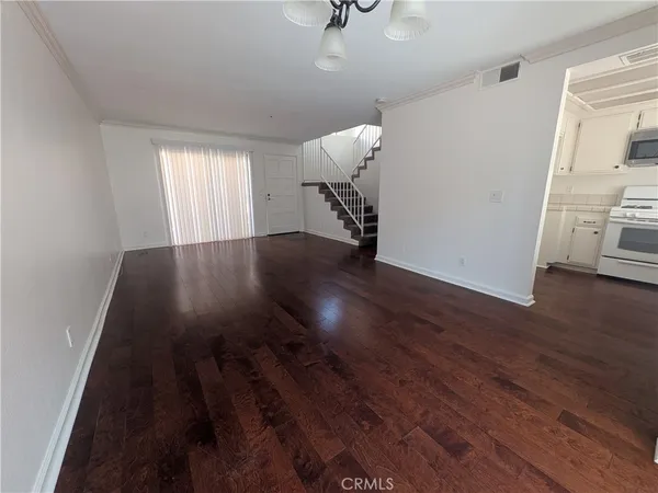 a view of a livingroom with wooden floor