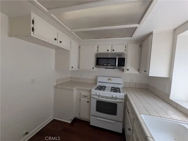 a kitchen with a stove and a microwave