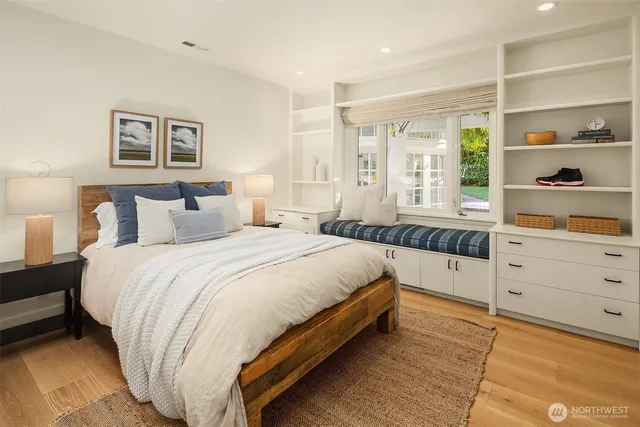 a bed room with a bed and a window