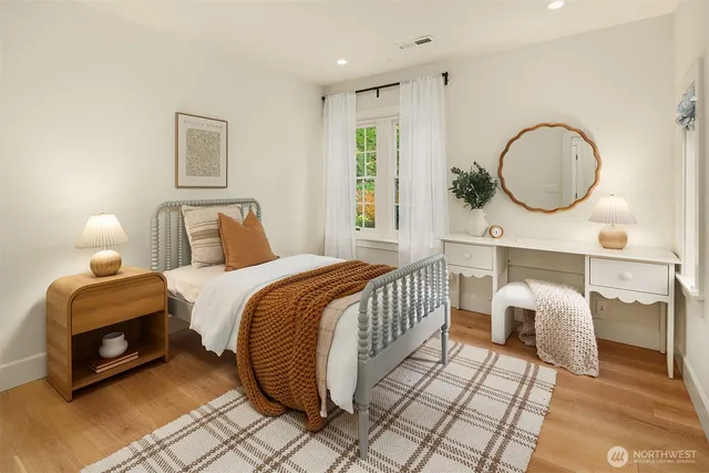 a bedroom with double bed and a window