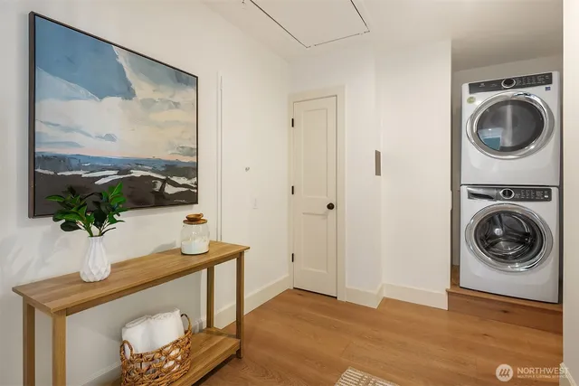 a view of a hallway with washer and dryer