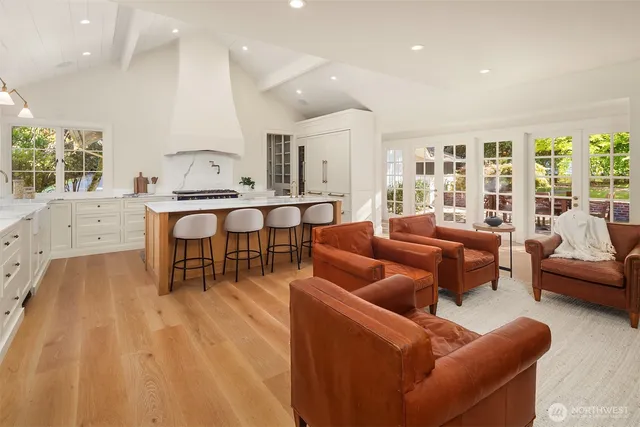 a living room with furniture a large window with outer view