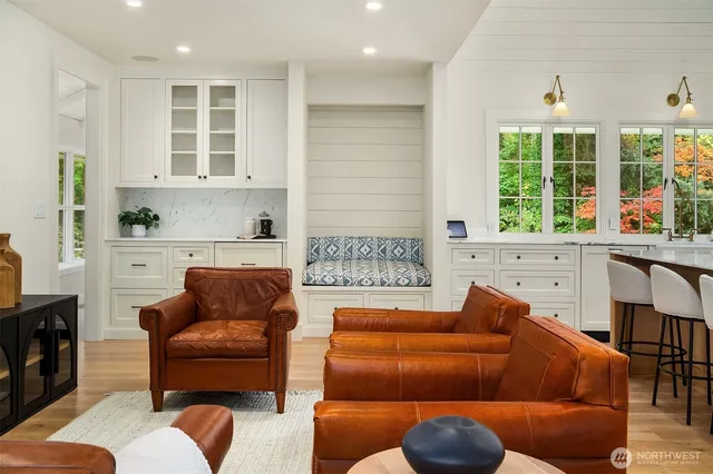a living room with furniture a window and a fireplace