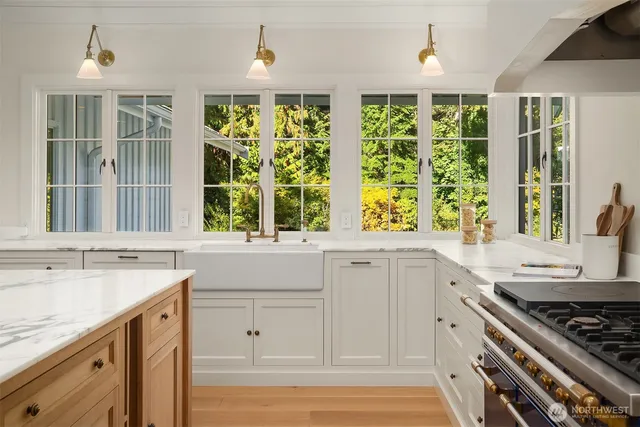 a kitchen with a sink stove and cabinets
