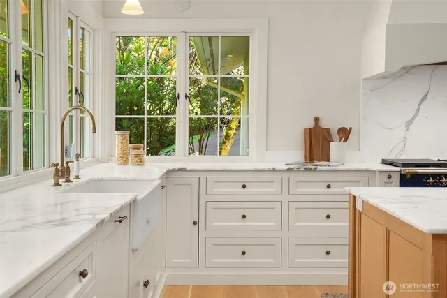 a kitchen with granite countertop a sink and a window