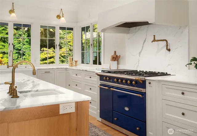 a kitchen with a stove and a sink