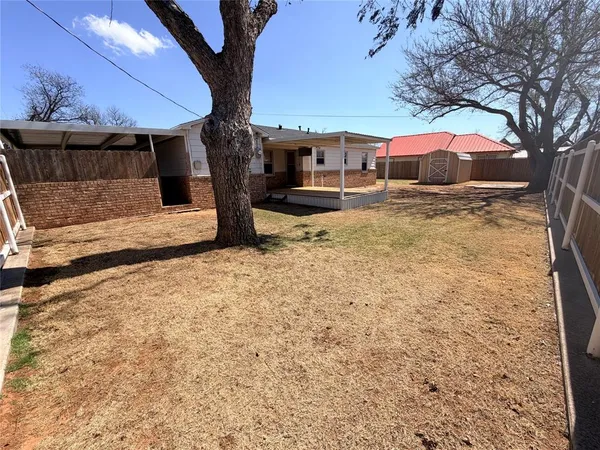 a house view with a backyard space