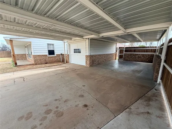 a view of a porch with a wooden floor
