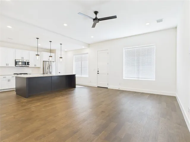 a view of kitchen with wooden floor and window