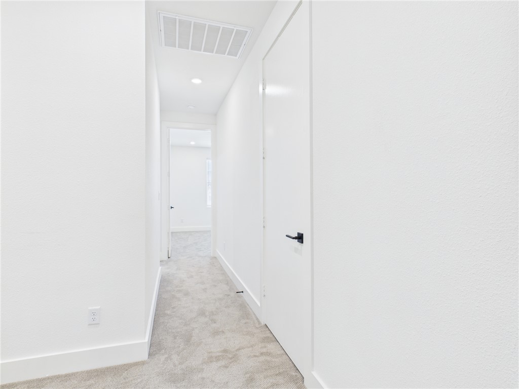 2940 Huffman Way College Station, TX 77840 - Photo 11 of 29 a view of a hallway with wooden floor