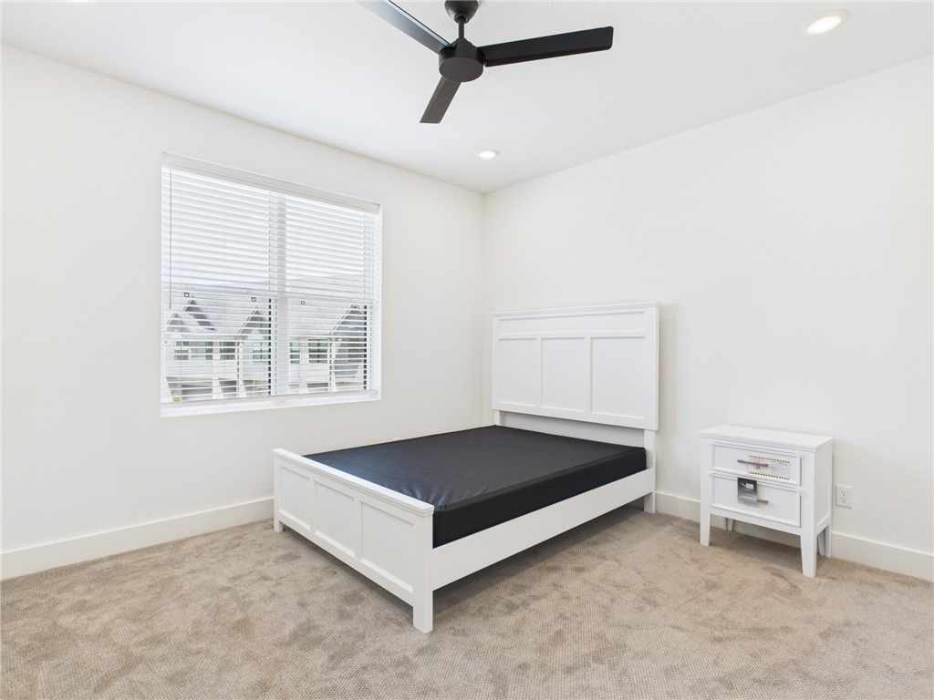 2940 Huffman Way College Station, TX 77840 - Photo 20 of 29 a living room with a bed and a window