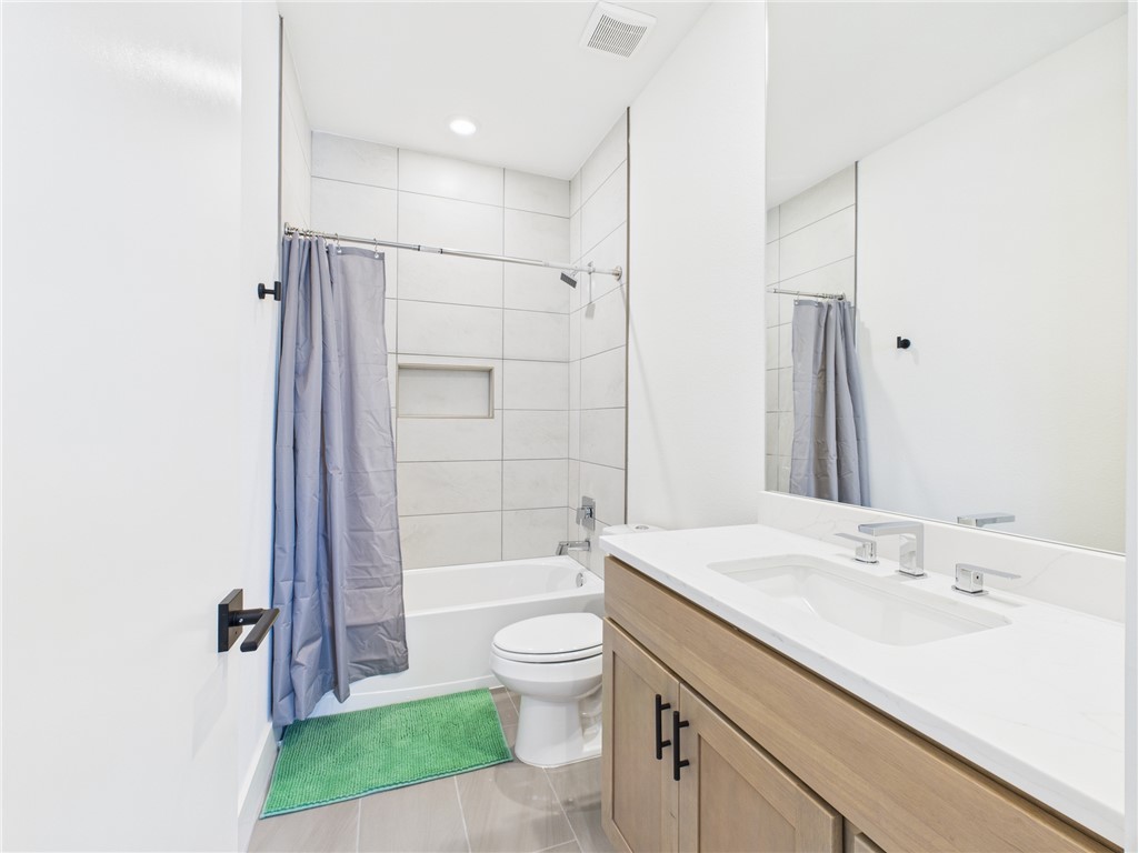 2940 Huffman Way College Station, TX 77840 - Photo 21 of 29 a bathroom with a sink a toilet and shower