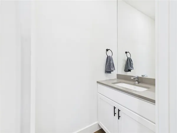 a bathroom with a sink and mirror
