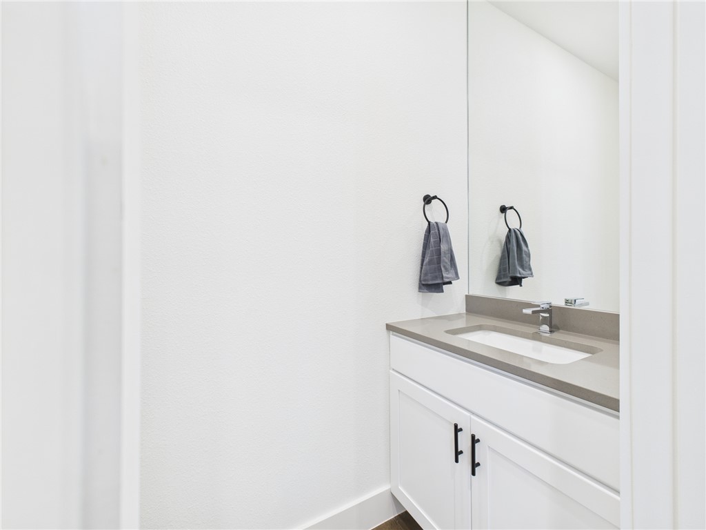 2940 Huffman Way College Station, TX 77840 - Photo 5 of 29 a bathroom with a sink and mirror