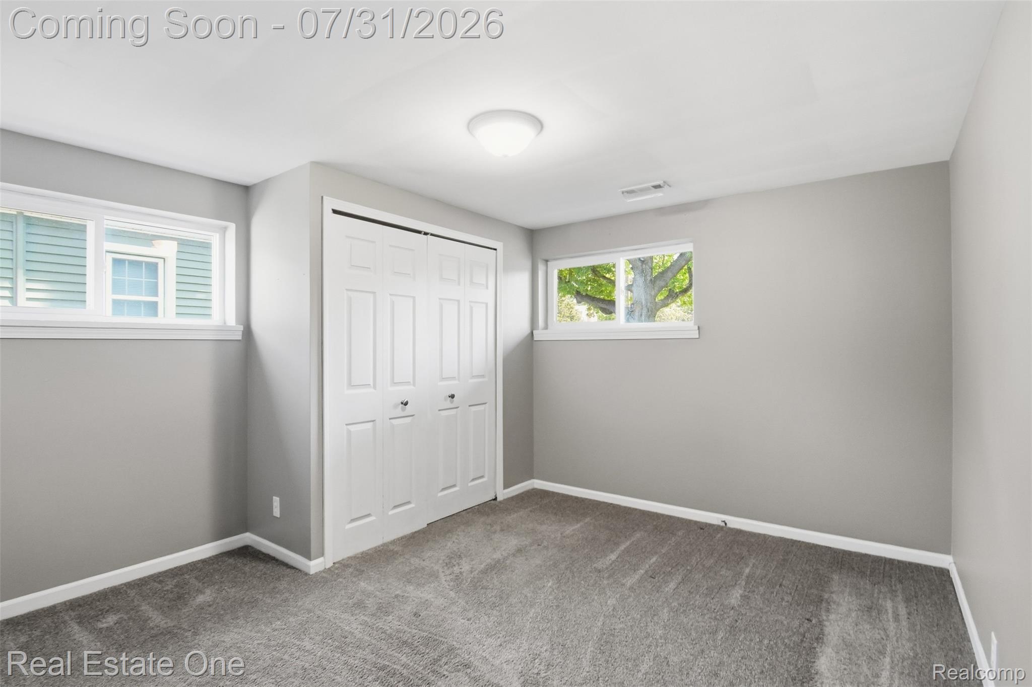 1615 South Commerce Road Walled Lake, MI 48390 - Photo 21 of 34 Room featuring neutral gray walls, plush gray carpeting, and white trim