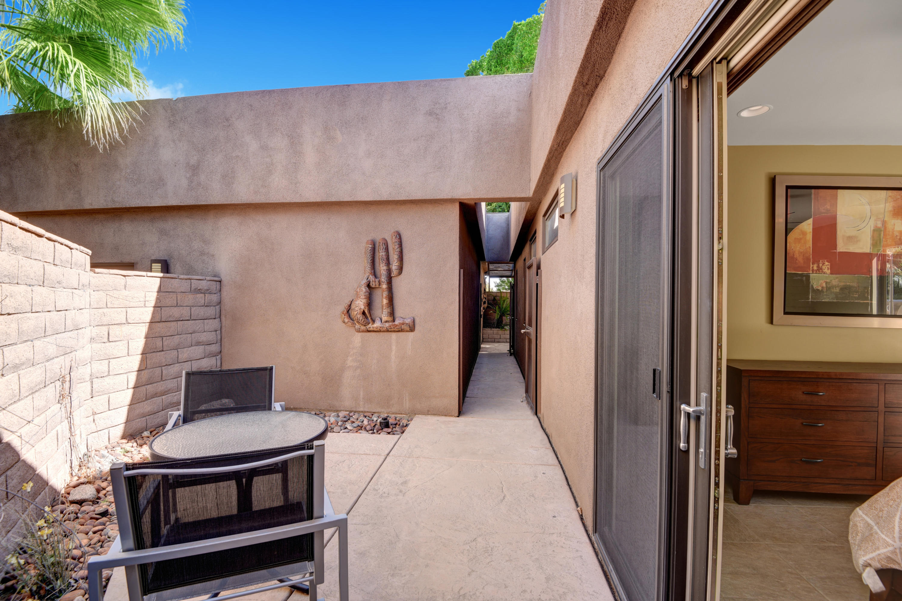 73543 Juniper Street Palm Desert, CA 92260 - Photo 12 of 44 a balcony view with a fireplace and a potted plant