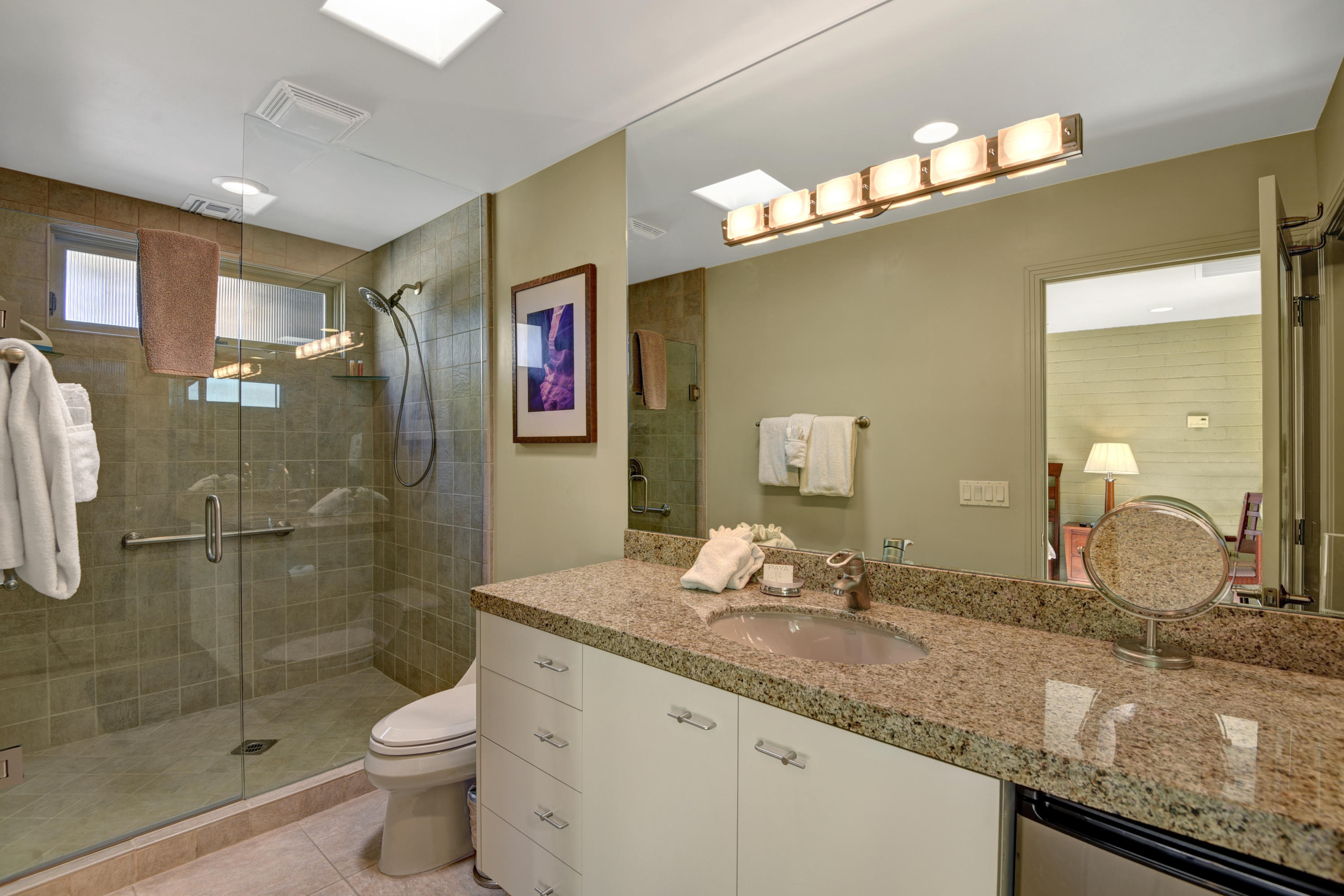 73543 Juniper Street Palm Desert, CA 92260 - Photo 13 of 44 a bathroom with a granite countertop sink a toilet and shower