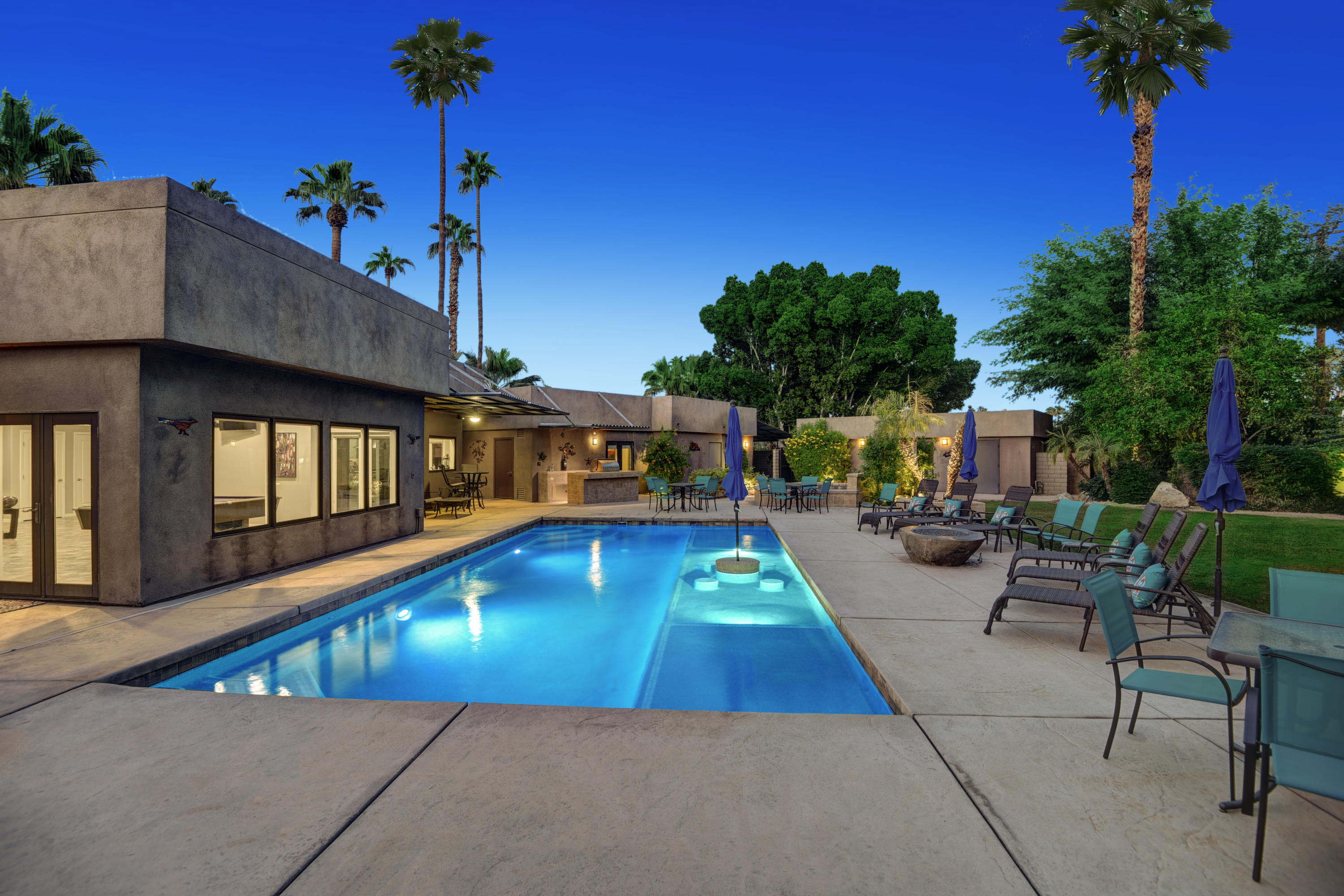 73543 Juniper Street Palm Desert, CA 92260 - Photo 2 of 44 a view of a swimming pool with a patio
