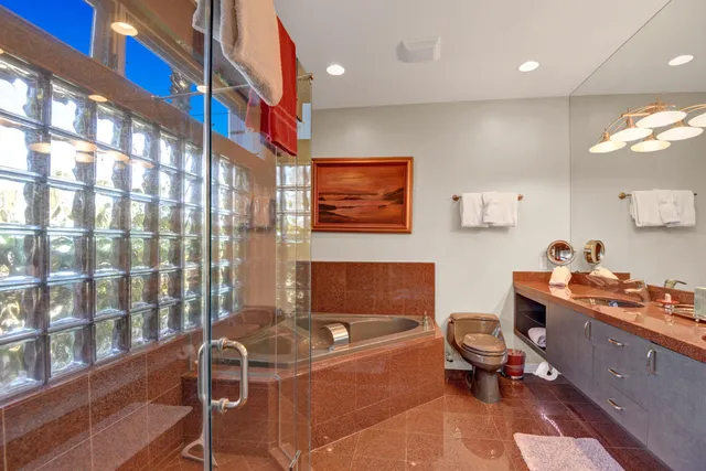 a living room with furniture and a painting on the wall