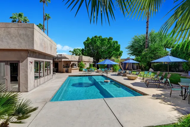 a view of a swimming pool with a patio