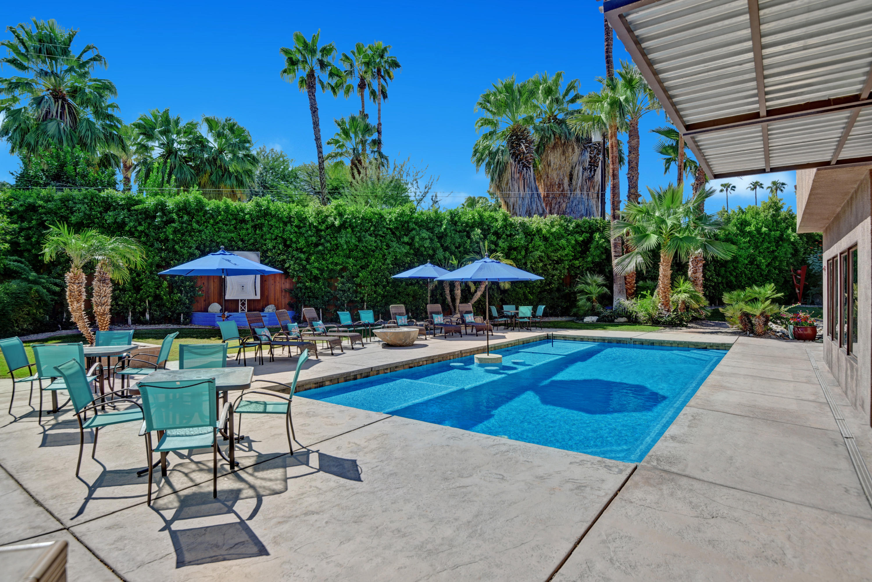 73543 Juniper Street Palm Desert, CA 92260 - Photo 37 of 44 a view of swimming pool with outdoor seating