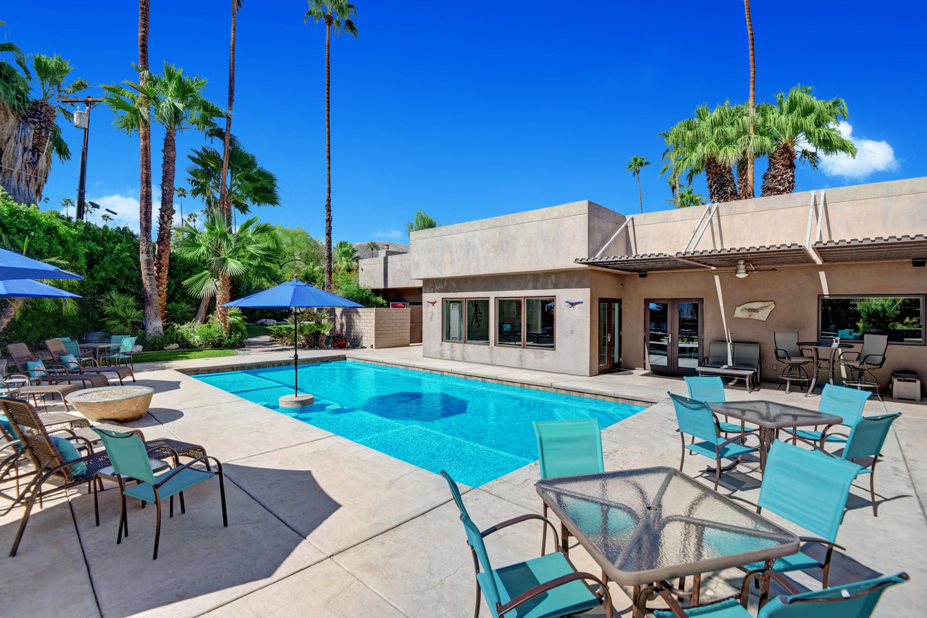 73543 Juniper Street Palm Desert, CA 92260 - Photo 38 of 44 a view of a swimming pool with chairs