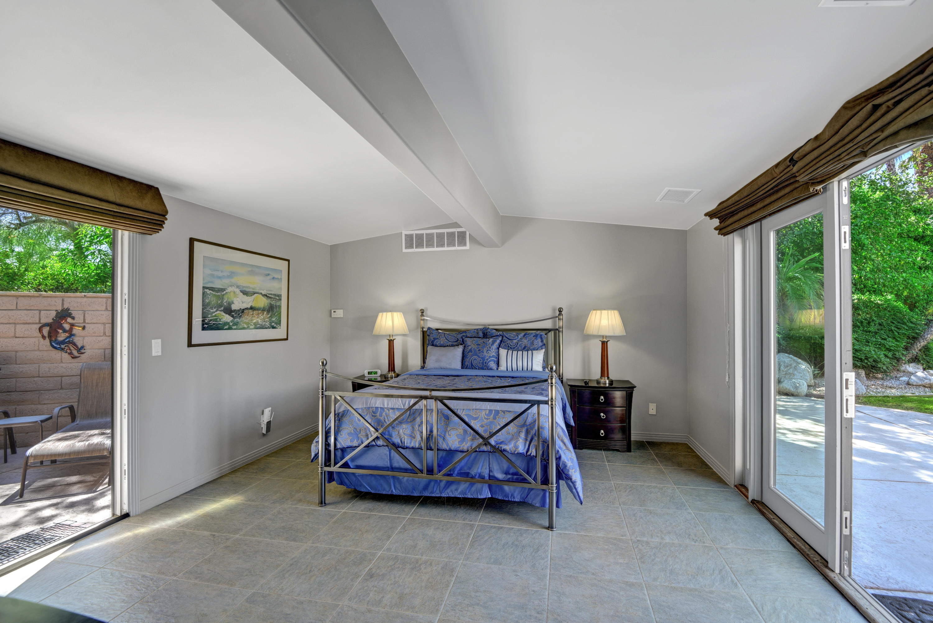 73543 Juniper Street Palm Desert, CA 92260 - Photo 5 of 44 a bedroom with a bed and a balcony