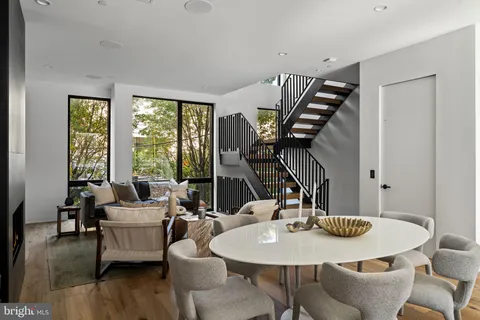 a kitchen with a table and chairs in it