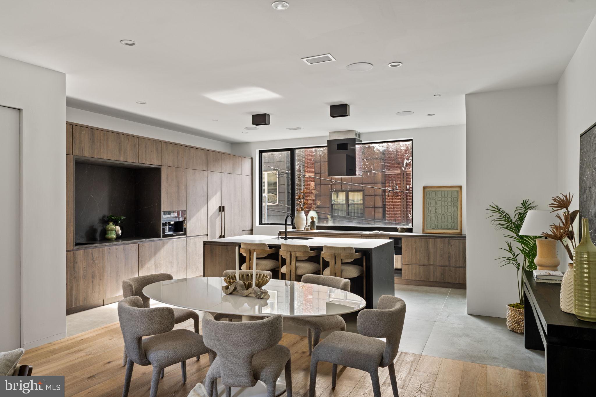 1428 Kenilworth Street Philadelphia, PA 19146 - Photo 13 of 58 a kitchen with a table and chairs in it