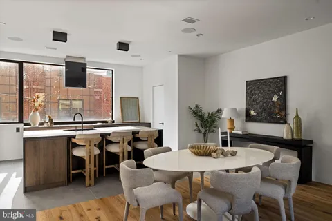 a room with furniture and a potted plant