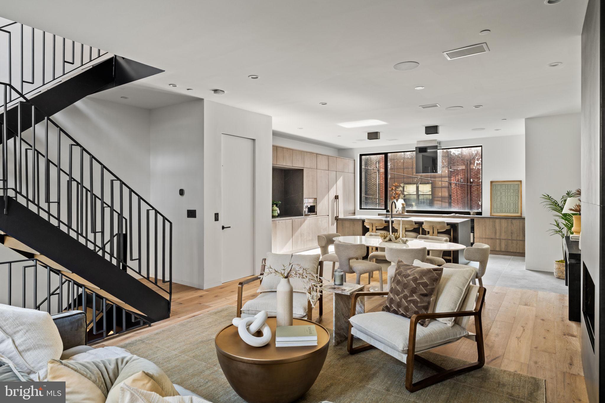 1428 Kenilworth Street Philadelphia, PA 19146 - Photo 15 of 58 a living room with furniture and a dining table