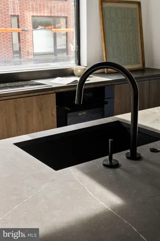 a kitchen with a sink and cabinets