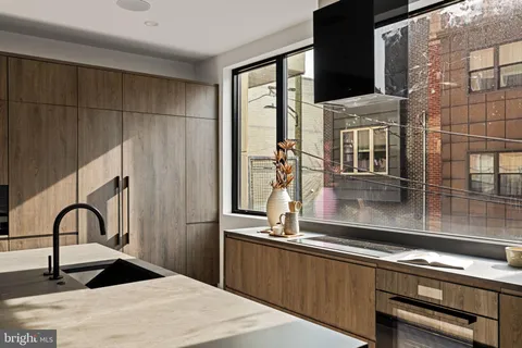 a kitchen with a sink and a refrigerator