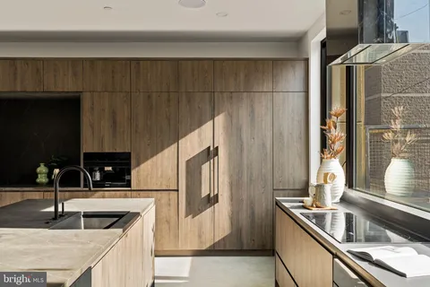 a close view of a sink and a bathroom with a toilet