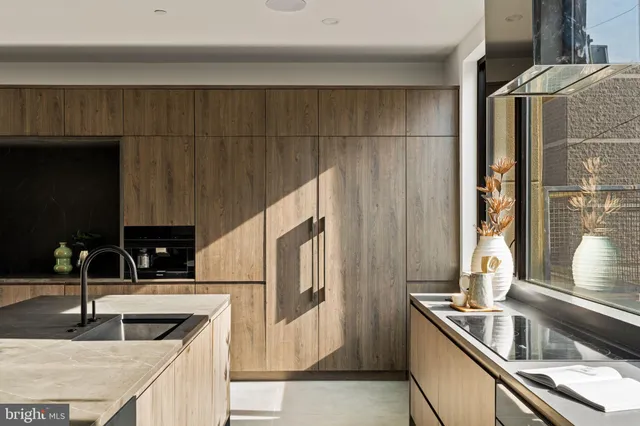 a close view of a sink and a bathroom with a toilet