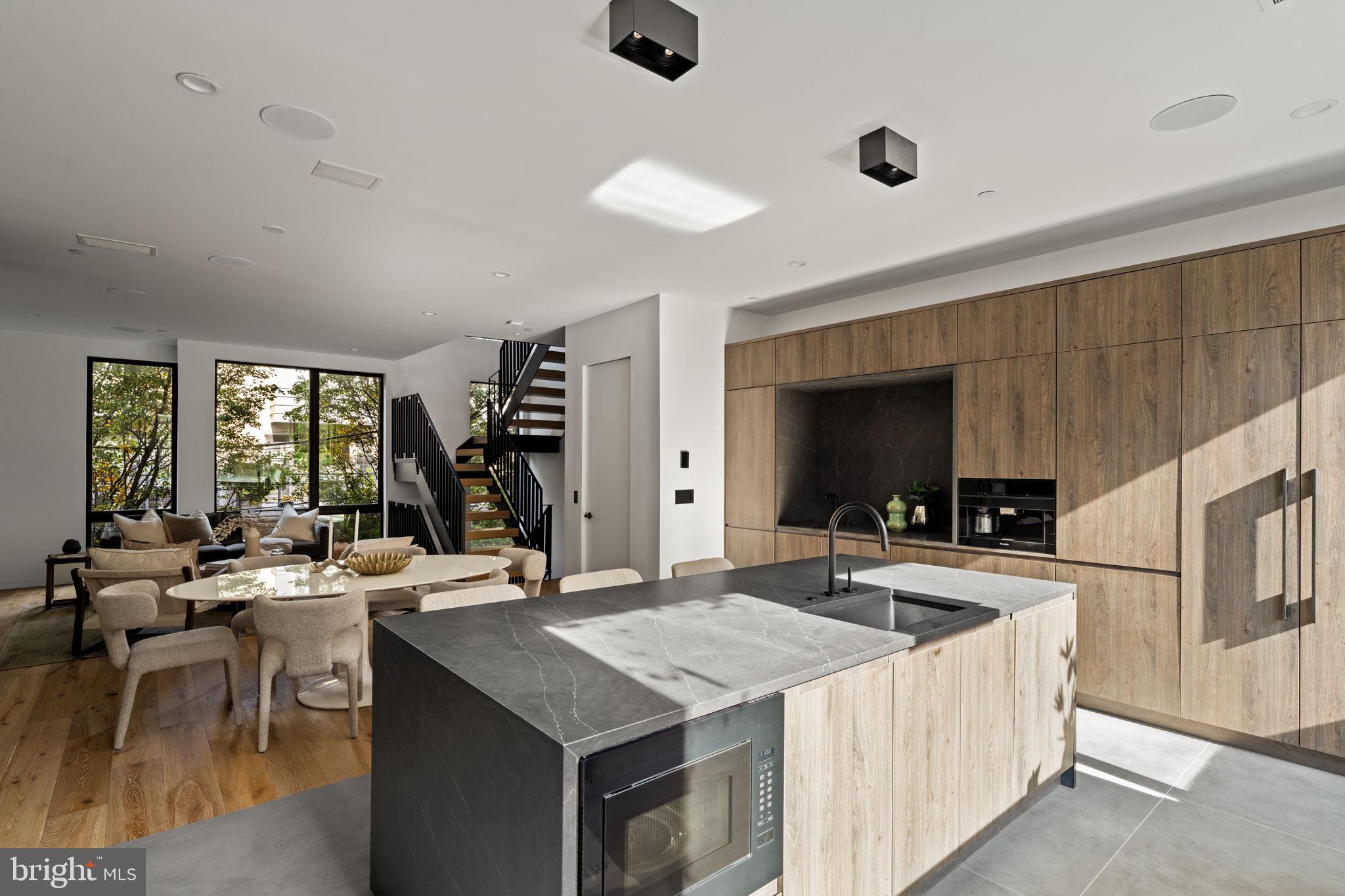 1428 Kenilworth Street Philadelphia, PA 19146 - Photo 22 of 58 a kitchen with counter top space and living room view