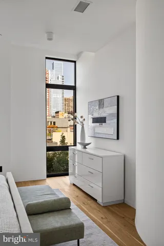 a bathroom with a granite countertop sink a mirror and a shower