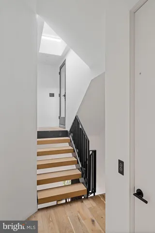 a bedroom with furniture and a large window