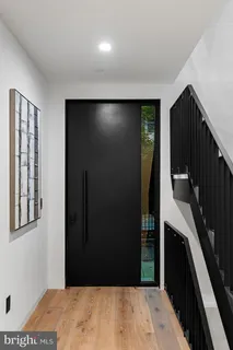 a view of a hallway with staircase