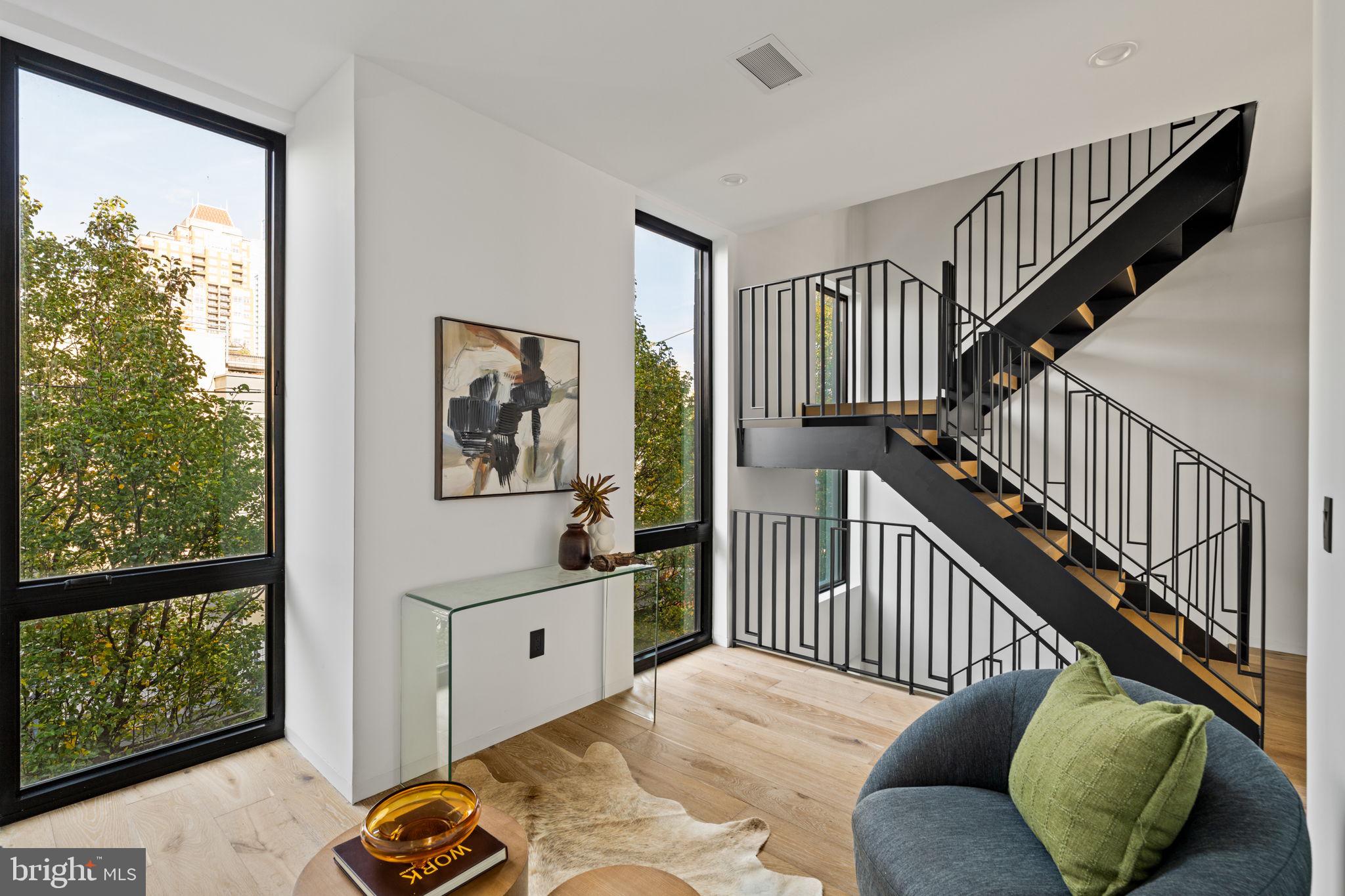 1428 Kenilworth Street Philadelphia, PA 19146 - Photo 46 of 58 a bedroom with furniture and a large window