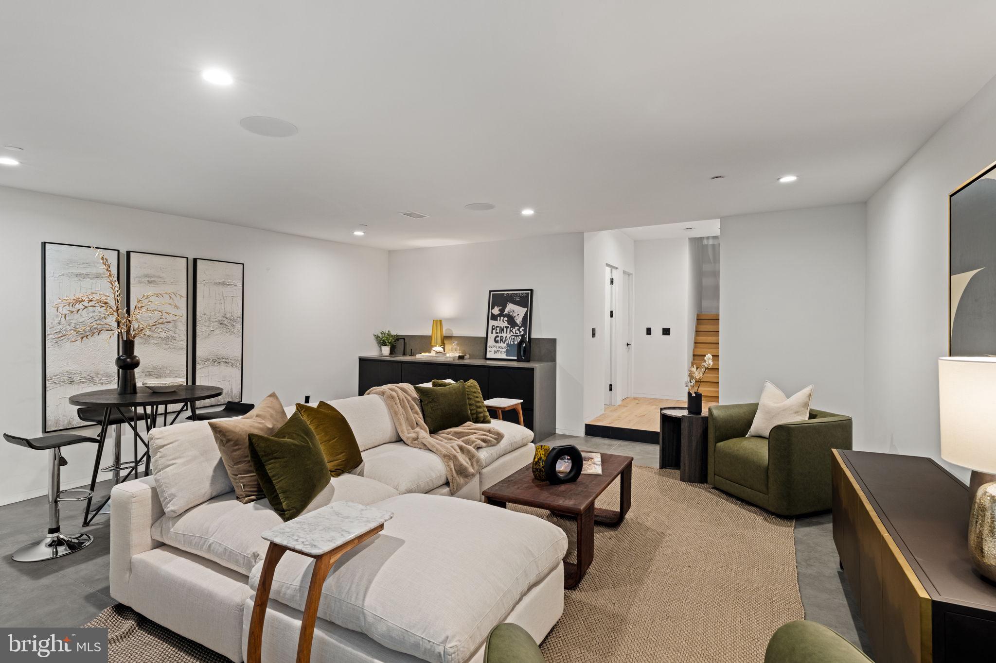 1428 Kenilworth Street Philadelphia, PA 19146 - Photo 51 of 58 a living room with furniture wooden floor and a large window