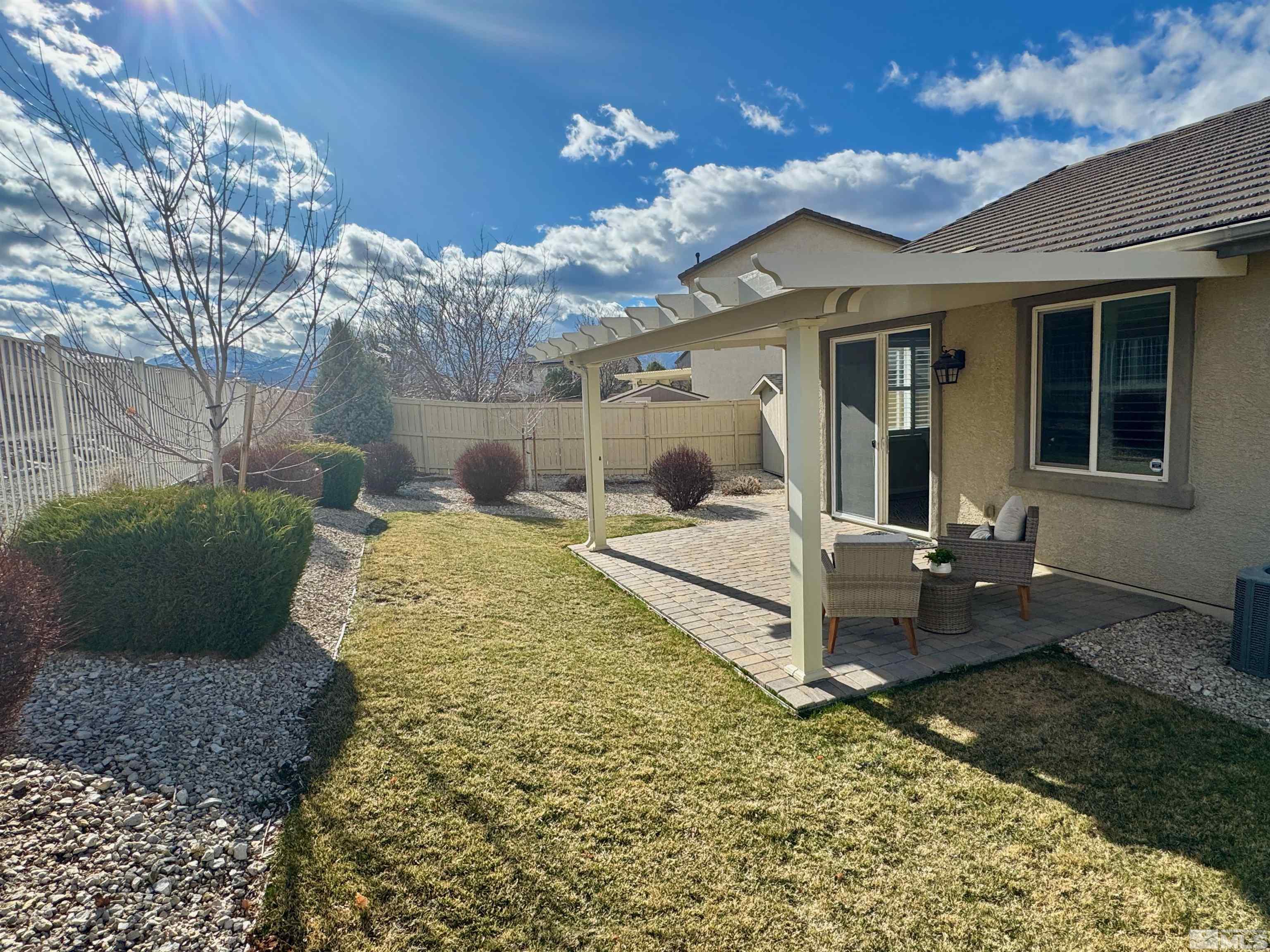 10797 Amber Falls Drive Reno, NV 89521 - Photo 2 of 38 a front view of a house with garden