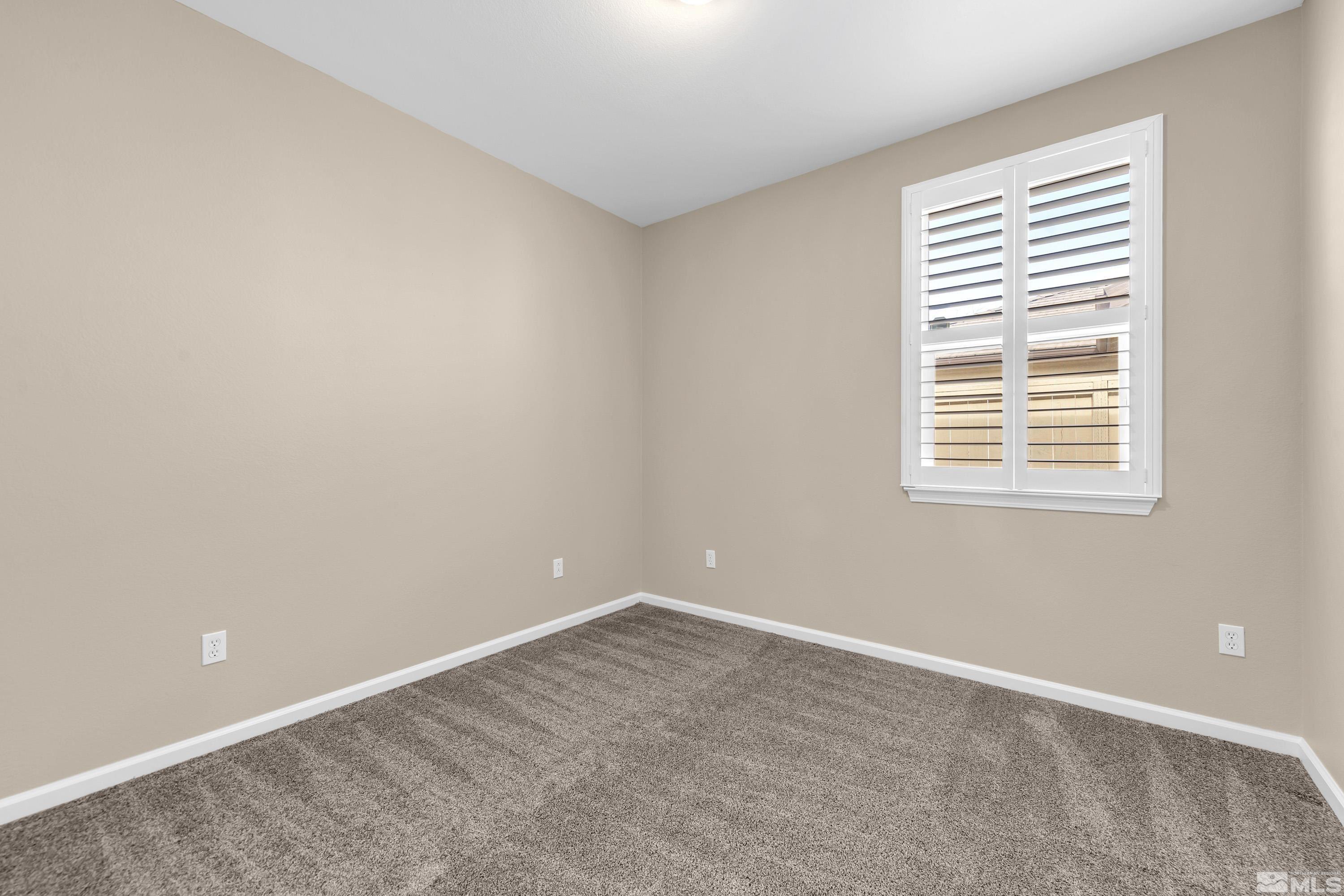 10797 Amber Falls Drive Reno, NV 89521 - Photo 21 of 38 a view of an empty room with a window