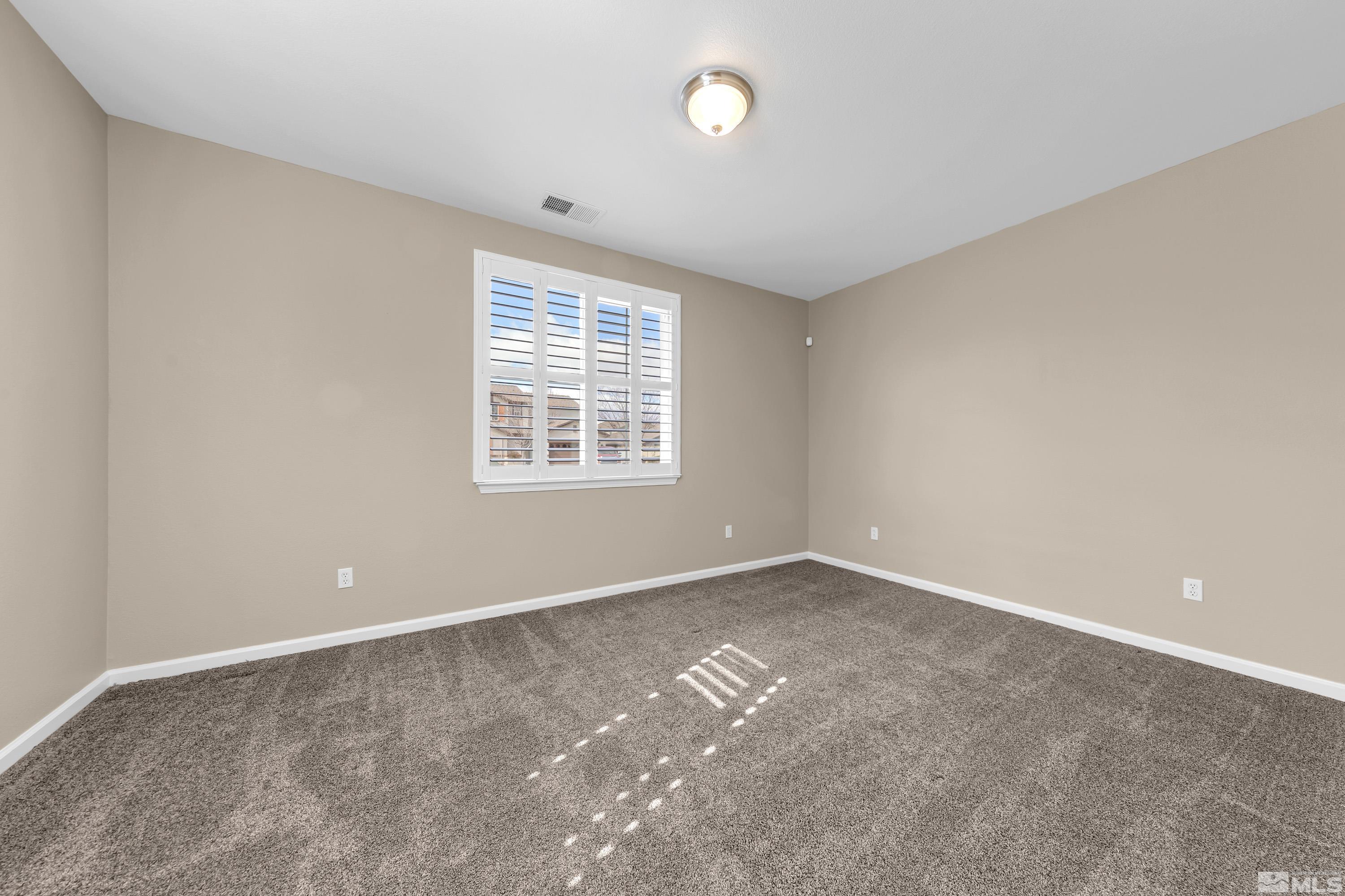 10797 Amber Falls Drive Reno, NV 89521 - Photo 22 of 38 an empty room with a window
